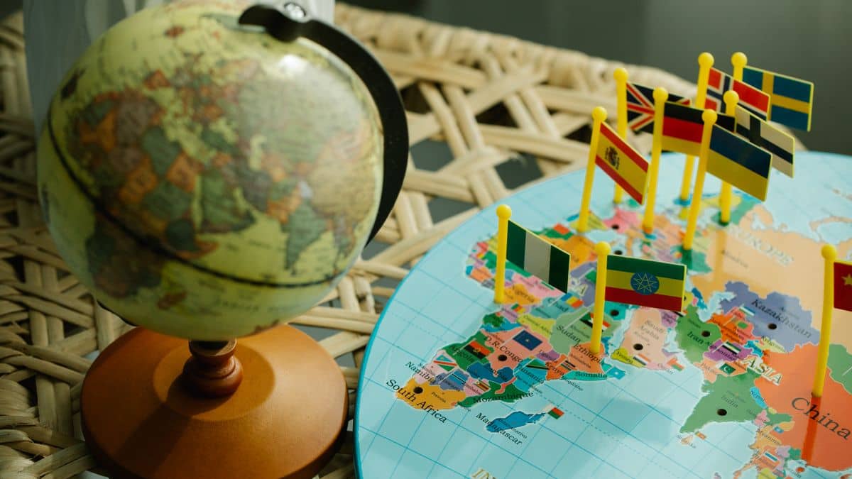 A globe and world map representing the choice between .co.tz, .tz and .com domains