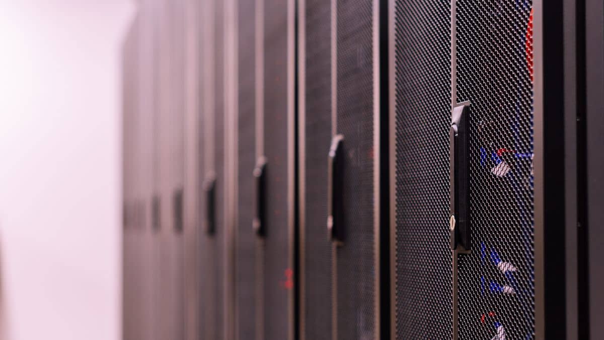 Server racks representing DNS records — A, CNAME, MX and TXT