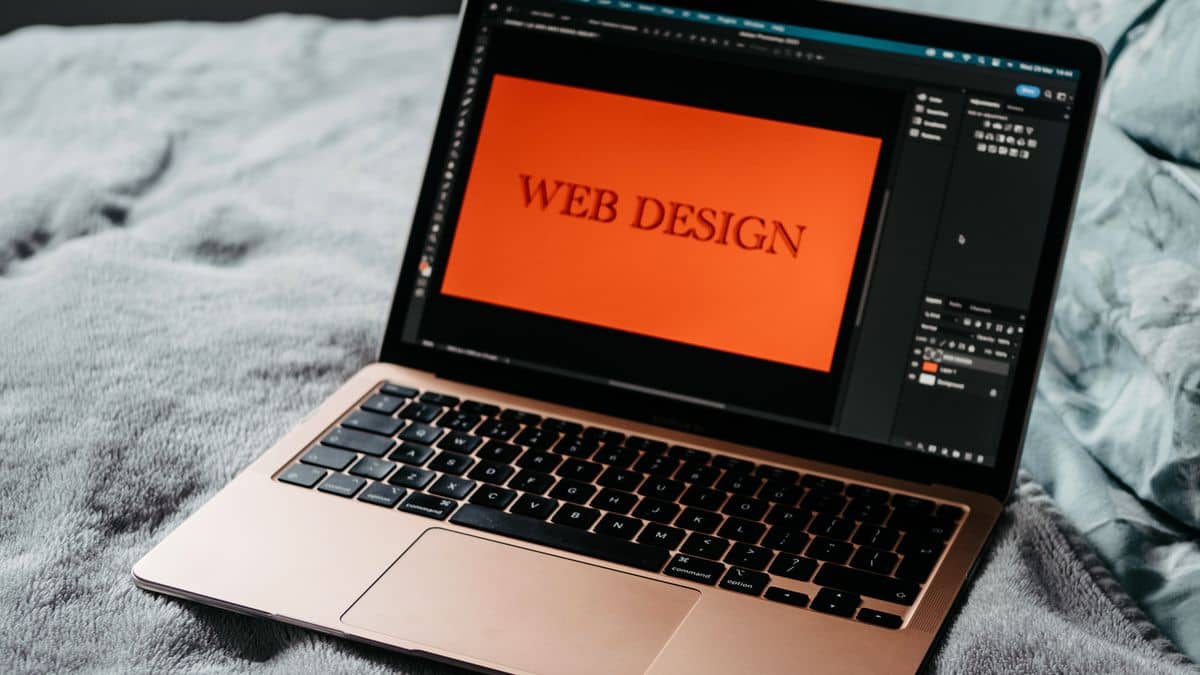 An open laptop showing web design, representing pointing a domain to a website