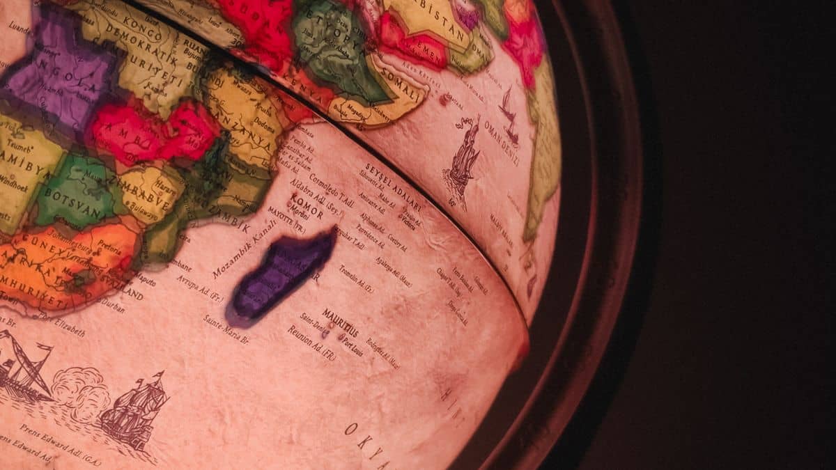 A glowing world globe representing the global reach of a .com domain